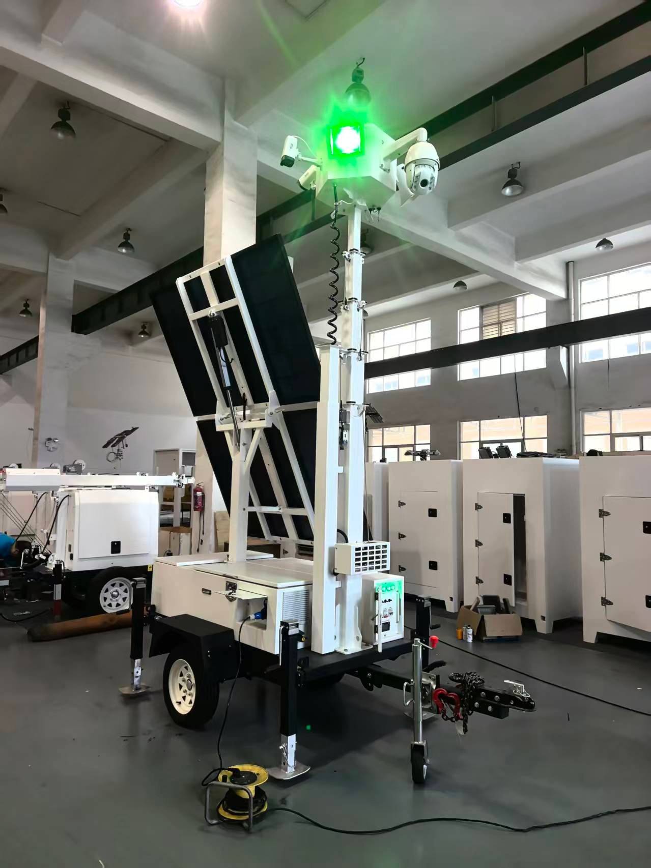 mobile solar surveillance tower with panels and mast raised